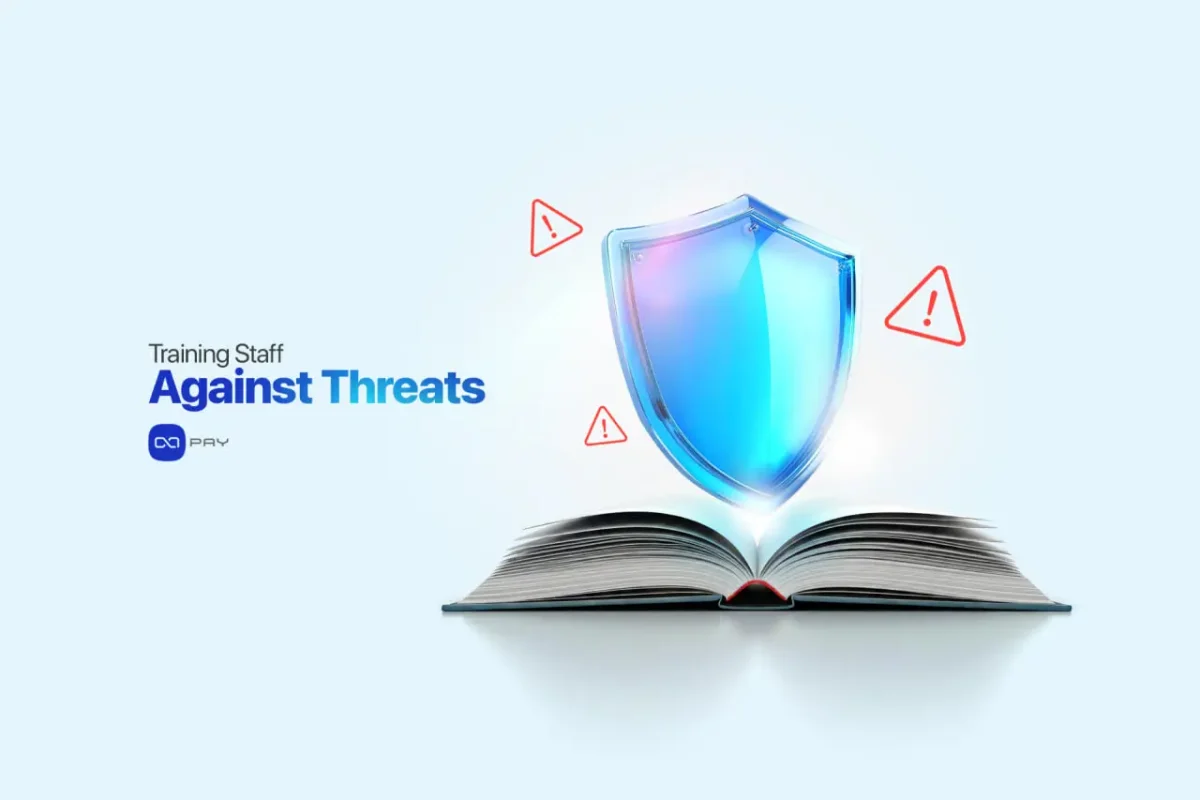 Training-Against-Threats Shield on an open book with warning signs symbolizing staff training against phishing